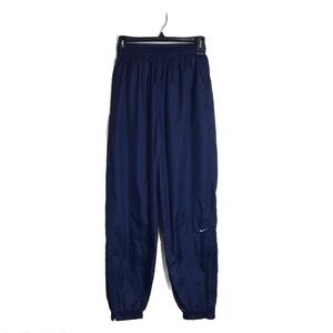 Vintage Nike dark blue windbreaker pants with swoosh on front leg size‎ M 8-10